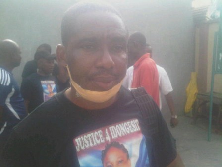 Godwin Udom, husband of Idongesit who survived the attack, during a protest at Ebute Meta court on Monday, 7 March, 2016