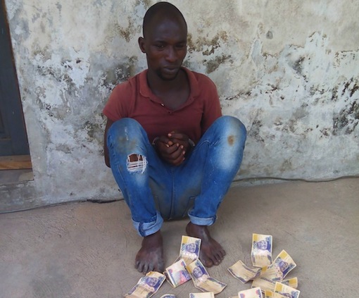 Ademola Abiodun with the fake N500 notes