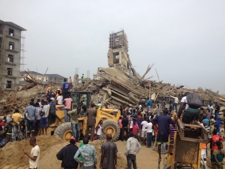 Residents look on in shock as the building under going construction collapsed killing six PHOTO: PM News