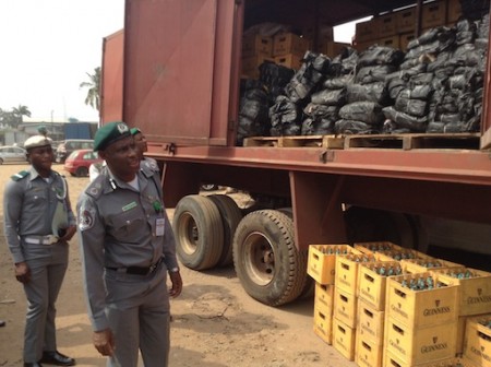 Comptroller Dahiru Umar inspecting the seized products