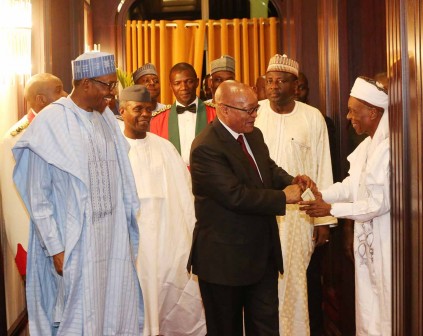  L-R; Former Nigeria High Commissioner to South Africa Alhaji Shehu Malami in a hand shake with the President of South Africa, Mr Jacob Zuma accompanied by Vice President Prof Yemi Osinbajo, President Muhammadu Buhari and others during a dinner for the visiting President Zuma at the State House in Abuja. PHOTO; SUNDAY AGHAEZE. MARCH 8 2016