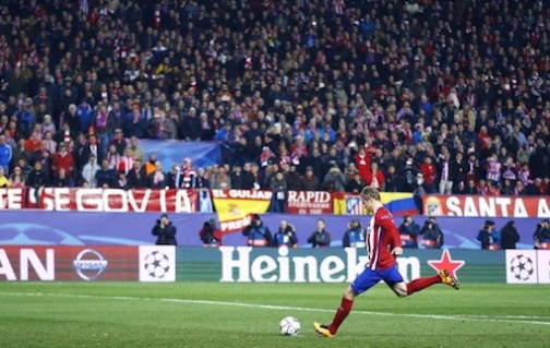 Fernando Torres takes his spot kick and scores