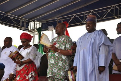 Governor Nyesom Wike flanked by national chairman of the PDP, Ali Modu Sheriff and his wife