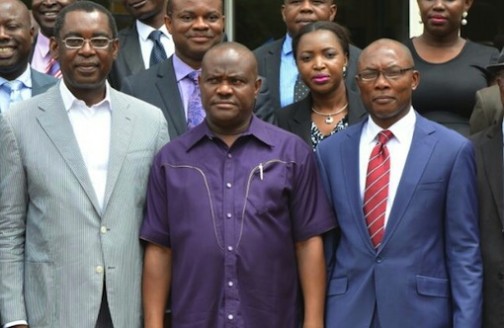Wike (m), Chairman of Port Harcourt Branch of the NBA, Mr Denis Okwakpam (r) and the Attorney General of Rivers State, Emmanuel Aguma, SAN, after the governor inaugurated the Local Organising Committee for the 2016 NBA Conference at the Government House, Port Harcourt on Wednesday