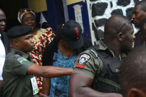 Mrs Ekwi Adebisa, INEC collation officer ushered away from Mile One police station