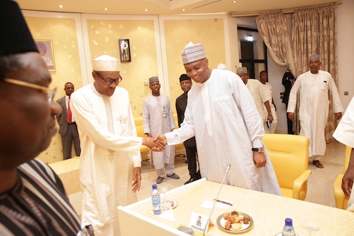 President Muhammadu Buhari shake hands with Senator Bukola Saraki