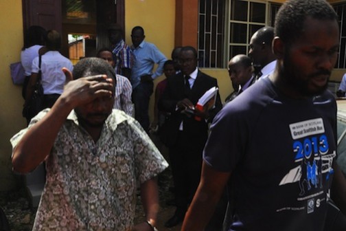 The two alleged fraudsters - Rilwanu Jamiu and Balogun Stanley Oyewole, arraigned by the Department of State Security (DSS) for cloning the mobile number of the Lagos State Governor, Mr. Akinwunmi Ambode at the Isolo Chief Magistrate Court on Wednesday, April 20, 2016