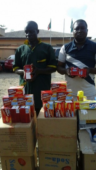 The suspects, Mr. Rabiu Olalekan and Mr. Hakeem Tiamiyu with their expired Digestive biscuits