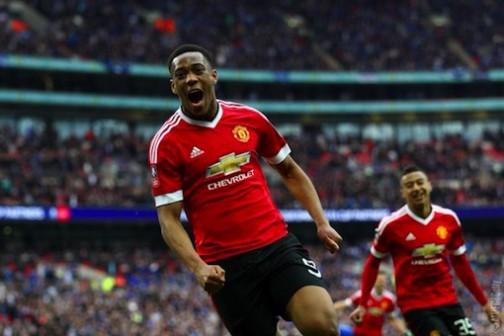 Anthony Martial wheels away after scoring the winner