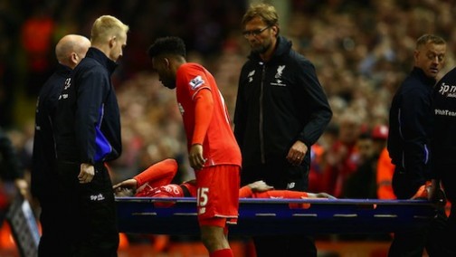 Divock Origi carried off the pitch