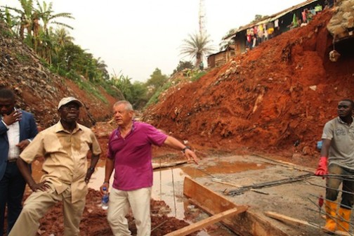 Governor Adams Oshiomhole of Edo State and Mr. Paulo Pistolesi, Area Manager, Hartland Nigeria Limited during the inspection of the underground drain at Upper Sokponba area of Benin City