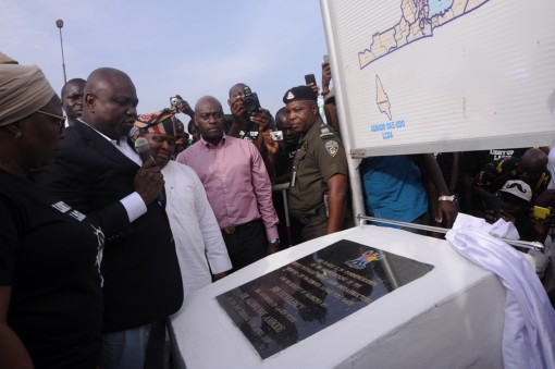 Lagos State Governor, Mr. Akinwunmi Ambode (2nd left), unveiling the plaque to commission the Light Up Lagos Project (newly installed Street Light infrastructure) on the Lagos-Abeokuta Expressway (Ile Zik – Toll Gate, Sango Ota), on Tuesday, April 12, 2016. With him are Senator Olamilekan Adeola (2nd right); Executive Secretary, Lagos State Security Trust Fund, Dr. AbdulRazaq Balogun (right) and Executive Secretary, Ojokoro LCDA, Fausat Hassan-Olajoku (left)