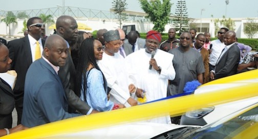 Lagos State Governor, Mr. Akinwunmi Ambode (2nd right), cutting the tape to receive 10 Patrol Vehicles donated by the MTN Foundation led by the Chairman, Prince Julius Adelusi-Adeluyi (3rd right) at the Lagos House, Ikeja, on Thursday, April 14, 2016. (L-R) With them are Executive Secretary, Lagos State Security Trust Fund (LSSTF), Dr. AbdulRazaq Balogun; Chairman, LSSTF, Mr. Oye Hassan-Odukale; Human Resources Executive, MTN Nigeria Communication Limited, Amina Oyagbola and Special Adviser, Office of Overseas Affairs & Investments (Lagos Global), Prof. Ademola Abass