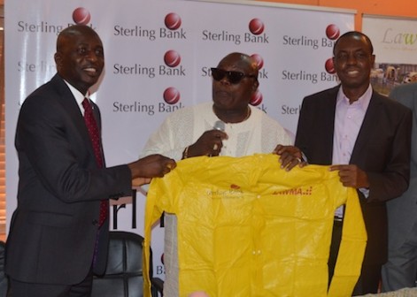 L-R: The bank's Executive Director, Corporate Banking, Mr. Kayode Lawal presenting a rain jacket to LAWMA's Executive Chairman, Mr. Olumuyiwa Adejokun and the General Manager, Engr. Abdulwahab Ogunbiyi at LAWMA Headquarters