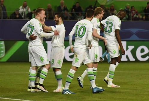 Wolfsburg players celebrate after scoring against Real Madrid in Germany