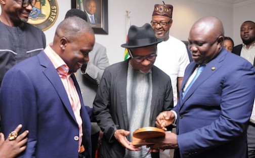 R-L: Lagos State Governor, Mr. Akinwunmi Ambode, presenting a State plaque to Grammy Award Winner, Mr. Kirk Whalum while the Brand Strategist, Runway Jazz, Mr. Ajani Sandridge, watches during a courtesy visit to the Governor by Groups collaborating with the Government on the forthcoming Lagos International Jazz Festival to commemorate the International Jazz Day, at the Lagos House, Ikeja, on Wednesday, April 27, 2016