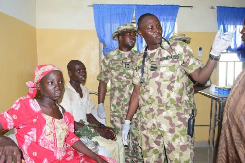 Amina Ali being examined with her supposed husband in the hospital