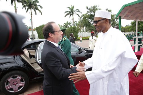 Hollande being received by President Muhammadu Buhari on arrival in Abuja