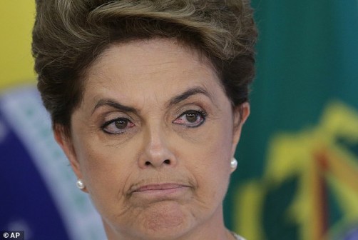 Brazil's President Dilma Rousseff attends a meeting on state land issues, at Planalto presidential palace in Brasilia, Brazil, Friday, April 15, 2016. The lower chamber of Brazil's Congress began a debate on whether to impeach Rousseff, a question that underscores deep polarization in Latin America's largest country and most powerful economy. The crucial vote is slated for Sunday. (AP Photo/Eraldo Peres)