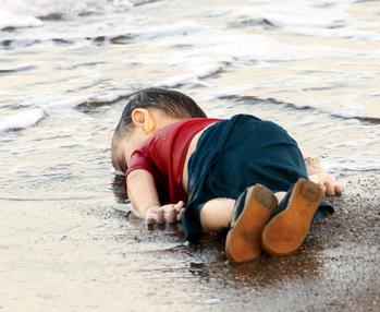 The photograph of Alan_Kurdi_lifeless_body after being washed ashore stirred the world's conscience to the migrant crisis