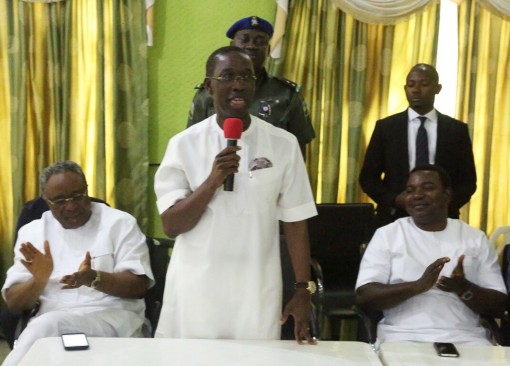 Delta State Governor, Ifeanyi Okowa addressing PDP members as Chief Lawrence Osiegbu (left) and Hon. Anthony Elekeokwur clap in admiration during the Ika North-East Local Government PDP Congress Executive Committee, in Boji Boji Owa