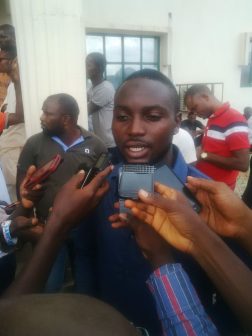 Amodu's son, Abdulaziz being interviewed by reporters