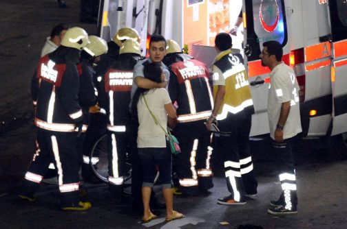 Paramedics help injured outside Turkey's largest airport, Istanbul Ataturk, Turkey, following a blast June 28, 2016. 