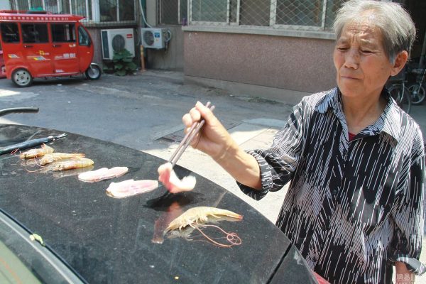 Chinese grandma doing carbecue