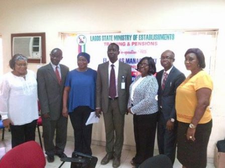 Top government staff and the consultant in a group picture after the training