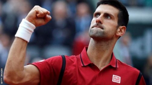 Novak Djokovic celebrates victory over Andy Murray to win first French Open 