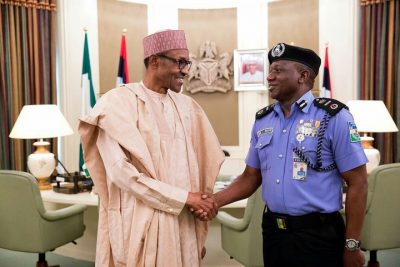 President Muhammadu Buhari congratulating the new acting Inspector General of Police, Ibrahim Kpotun Idris