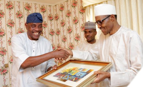  President Muhammadu Buhari presenting a parting gift to the out going Inspector General of Police, Mr Solomon Arase