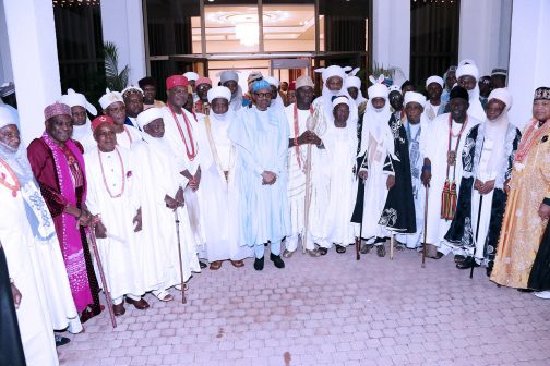 President Muhammadu Buhari (M) in a group photograph with some  of the traditional rulers.