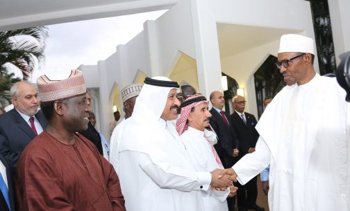 President Muhammadu Buhari in a handshake with diplomats