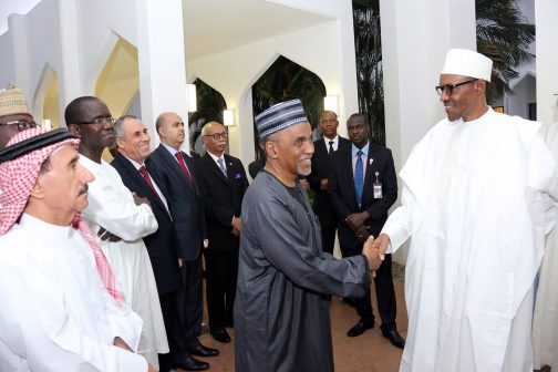 President Muhammadu Buhari in a handshake with Dean of the Diplomatic Corps and Cameroon Ambassador to Nigeria, Salaheddine Abbas-Ibrahima