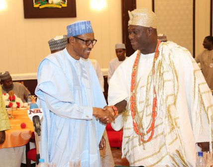 President Muhammadu Buhari in a hand shake with the Ooni of Ife, HRM Adeyeye Ogunwusi at the breaking of fast