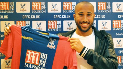 Andros Townsend is all smile as he holds up a Crystal Palace