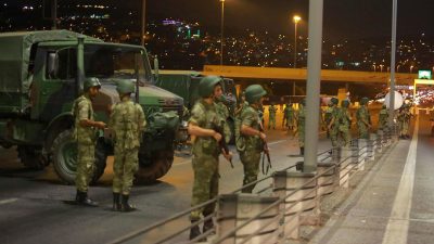 Turkish military block access to the Bosphorus bridge, which links the city's European and Asian sides, in Istanbul, Turkey before the plotters were rounded up. [Reuters]