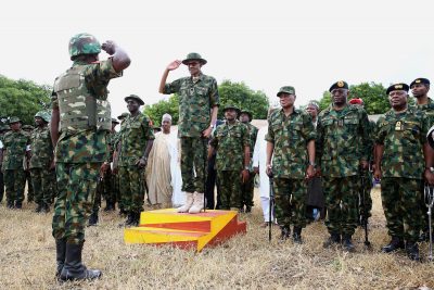 President Muhammadu Buhari taking the salute during interaction with the troops