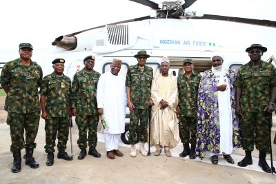 President Muhammadu Buhari with members of his entourage and officers of the brigade after the interaction