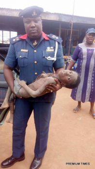 The boy being carried by a NSCDC official 