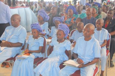 Husband of the deceased and her children in church 