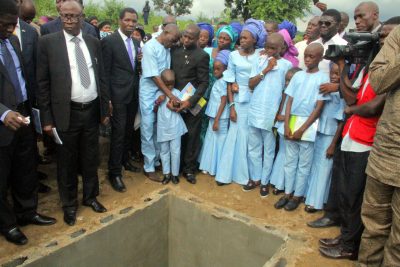 Officiating pastors with the seven children of the deceased and their father 