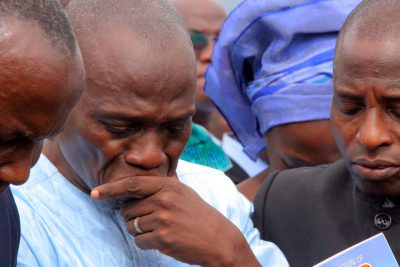 Husband of the deceased, Pastor Olawale Elisha, during the burial service