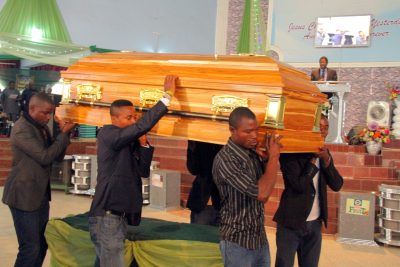The body of the deceased being taken for burial after the church service 