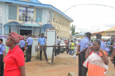 Armed policemen at the entrance of the church (Redeemed Christian Church of God, New Life Assembly, Kubwa) during the church service. 