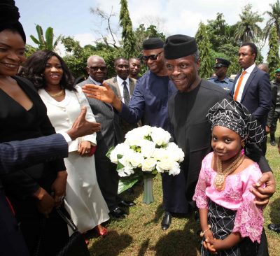 Vice President Osinbajo given a bouque of flowers on arrival