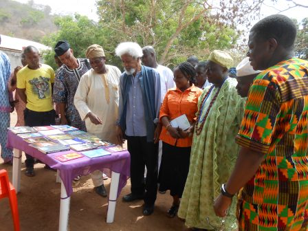 Prof. Wole Soyinka in Ebedi, inspecting books by residents