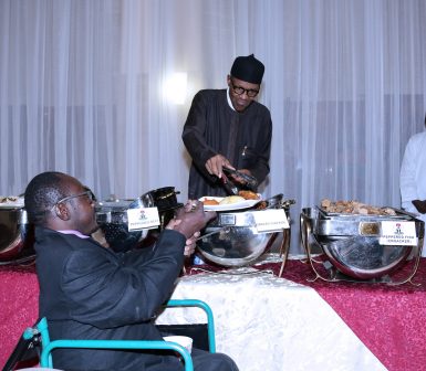 President Muhammadu Buhari serving another of his guests