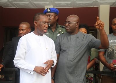 Delta State Governor, Ifeanyi Okowa (left) and the Commissioner for Information, Mr. Patrick Ukah, during the governor's condolence visit to the family of Late Stephen Keshi, at Illah, Delta State.